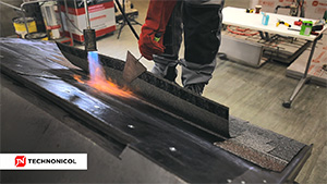 Installation of roofing shingles by TECHNONICOL - torching method